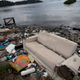 Maybe they’ll have to change it from rowing to couch-surfing. AP Photo/Silvia Izquierdo, File